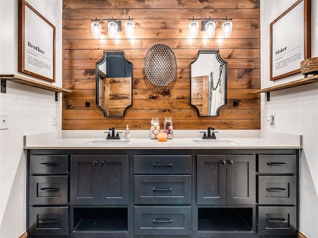 bathroom with vanity and wooden walls