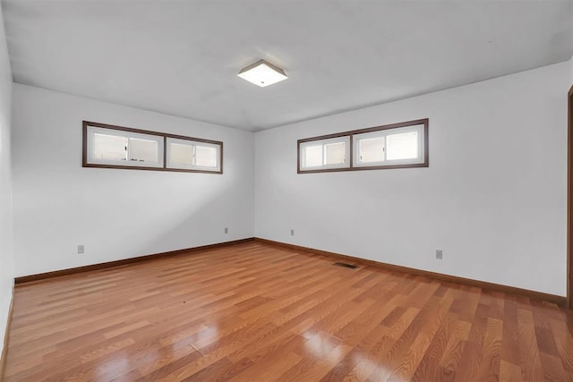 unfurnished room featuring light hardwood / wood-style floors