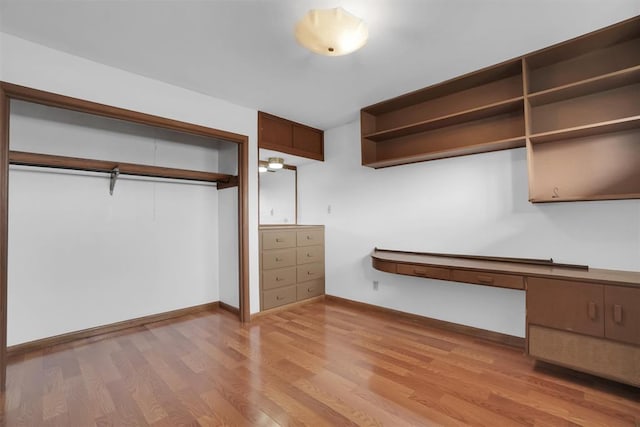 spacious closet featuring light hardwood / wood-style flooring