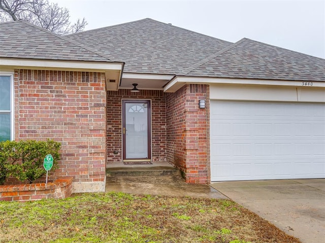 entrance to property featuring a garage