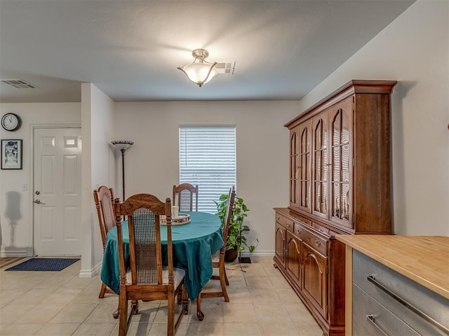 dining area featuring light tile patterned floors