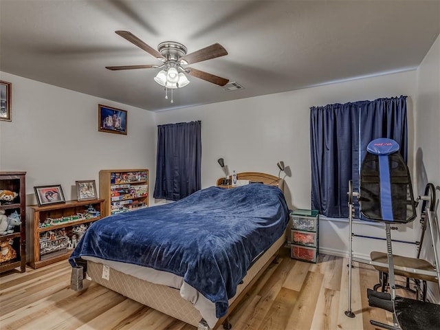 bedroom featuring ceiling fan and light wood-type flooring