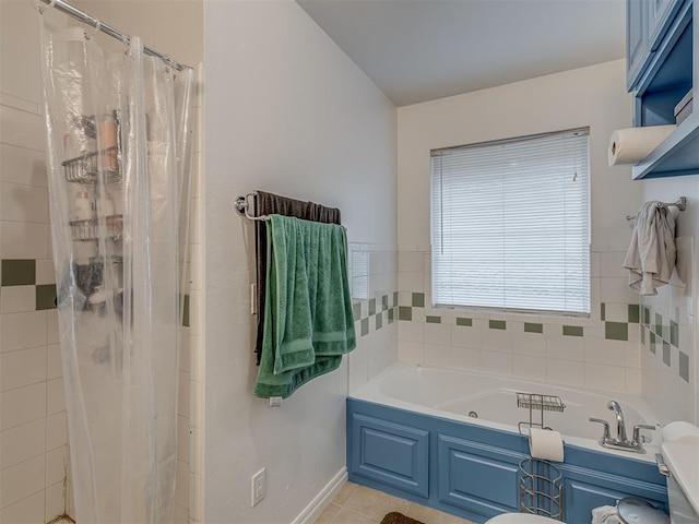 bathroom featuring tile patterned floors and shower with separate bathtub