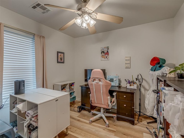 office space with ceiling fan and light hardwood / wood-style floors