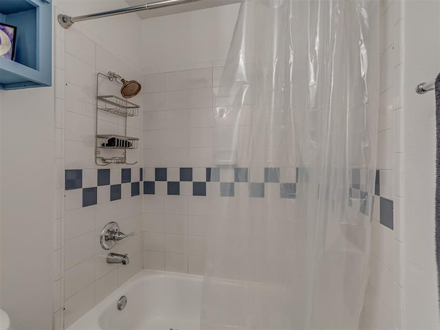 bathroom with shower / bathtub combination with curtain