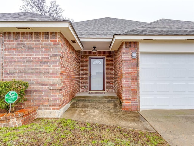 view of exterior entry featuring a garage