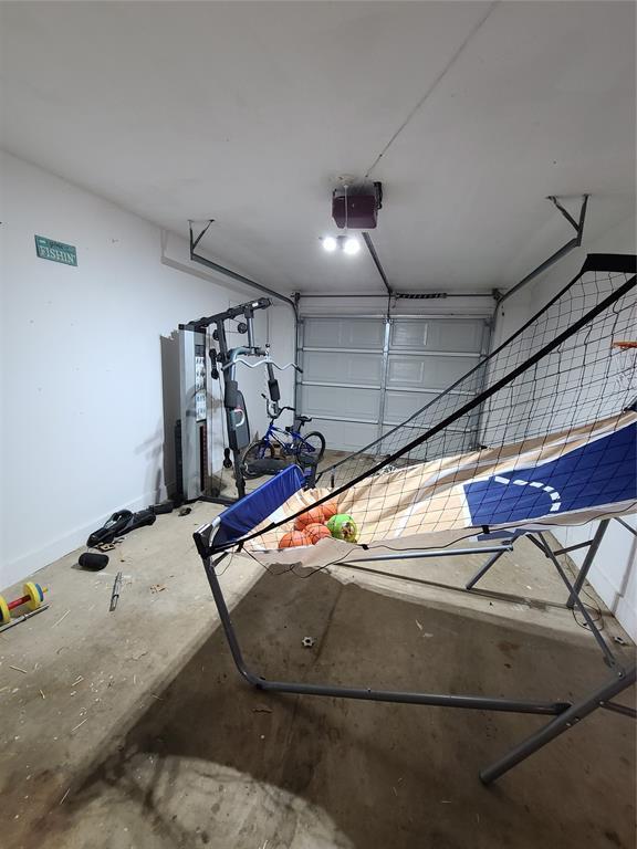 garage featuring a garage door opener