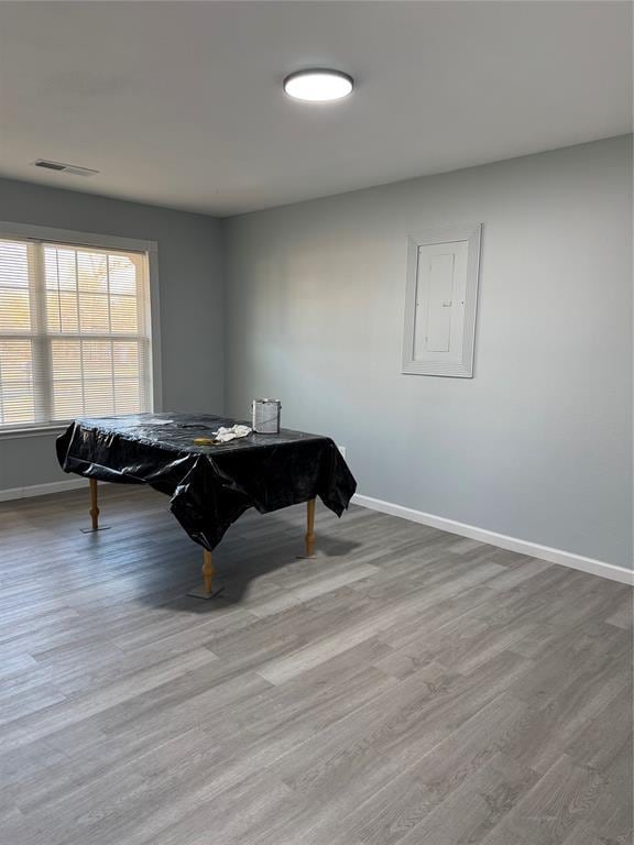 playroom with pool table, wood-type flooring, and electric panel