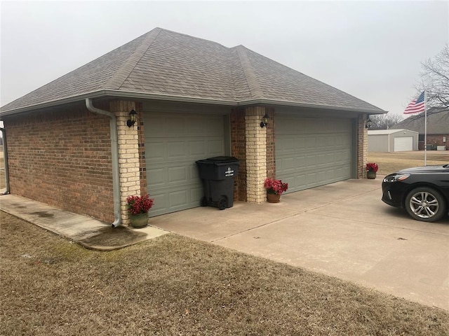 view of home's exterior featuring a garage and an outdoor structure