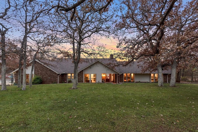 ranch-style house with a yard