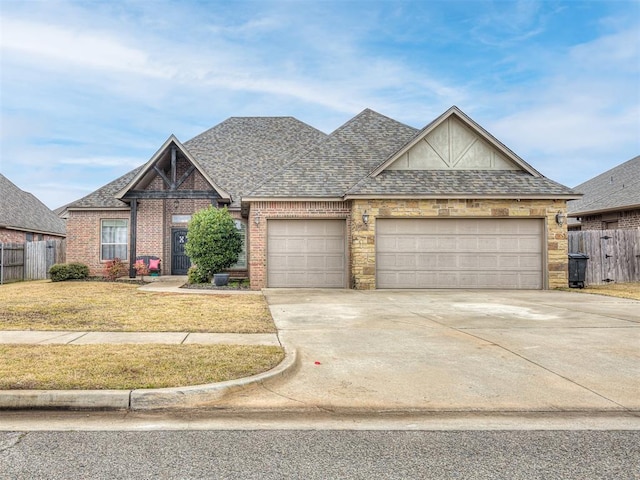 view of front of property with a garage and a front yard