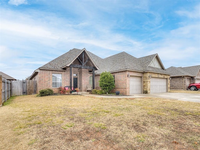 view of front of house with a garage and a front lawn