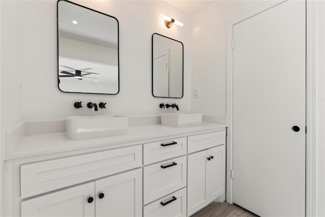 bathroom featuring vanity and hardwood / wood-style floors