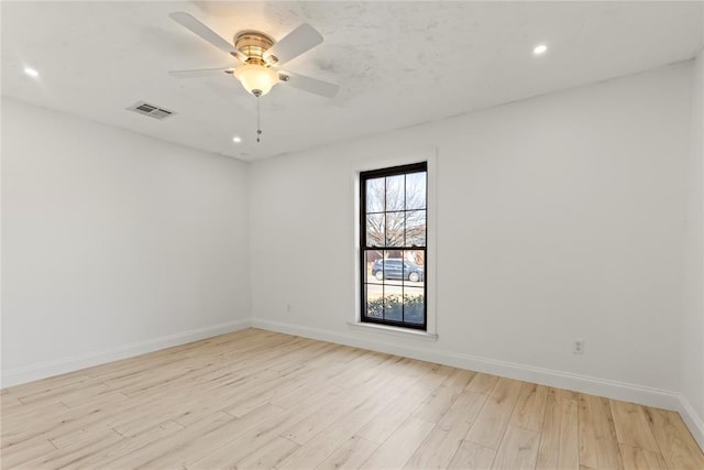 spare room featuring ceiling fan and light hardwood / wood-style floors