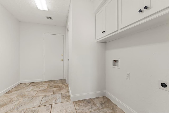 washroom featuring electric dryer hookup, washer hookup, and cabinets