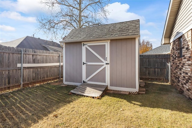 view of outbuilding featuring a lawn