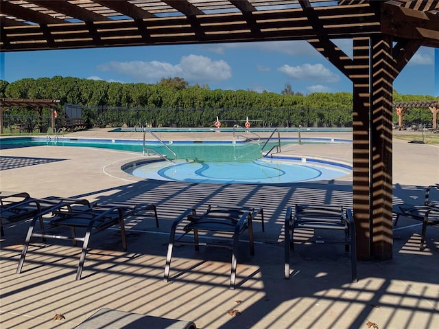 view of pool with a pergola and a patio