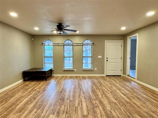 interior space featuring ceiling fan and light hardwood / wood-style floors