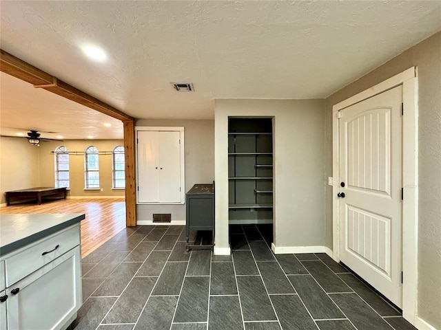 interior space with dark hardwood / wood-style floors and a textured ceiling