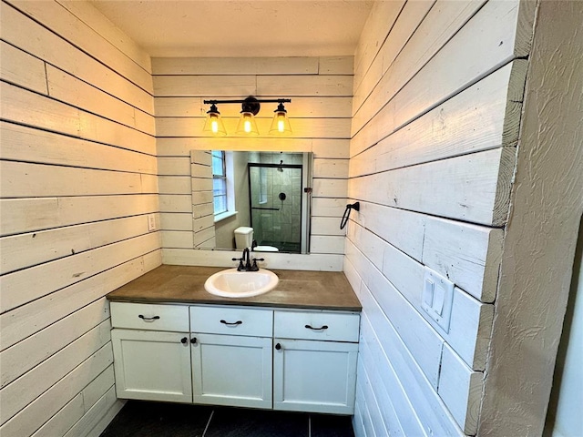 bathroom with vanity and wood walls