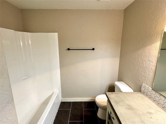 bathroom with vanity, tile patterned floors, a bathing tub, and toilet