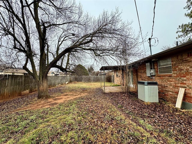 view of yard with cooling unit and a patio area