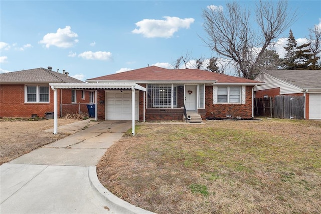 ranch-style house featuring a garage and a front lawn