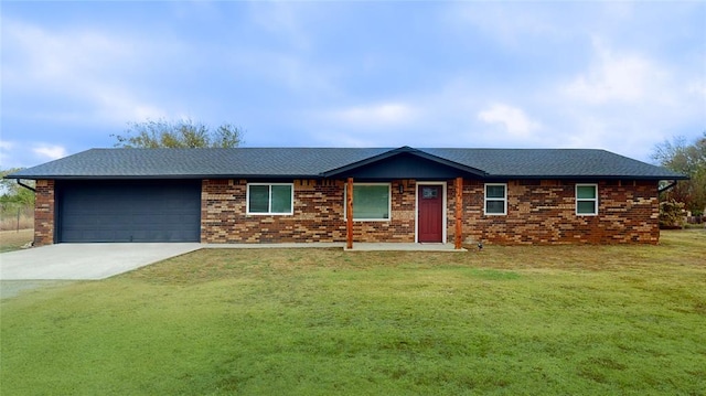 ranch-style home featuring a garage and a front lawn