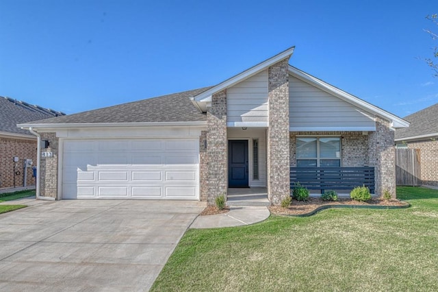 view of front of home featuring a garage and a front lawn