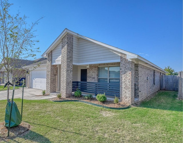 view of front of house with a garage and a front lawn