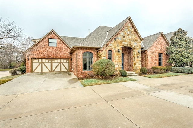 tudor home featuring a garage