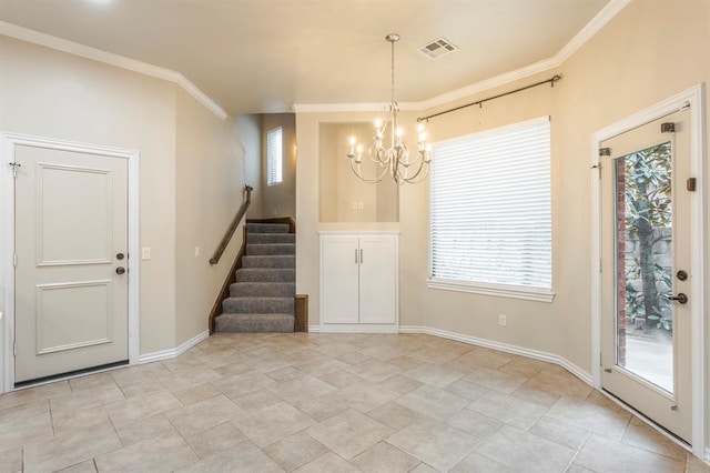 interior space with ornamental molding and a chandelier