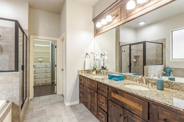 bathroom with vanity, tile patterned floors, and separate shower and tub