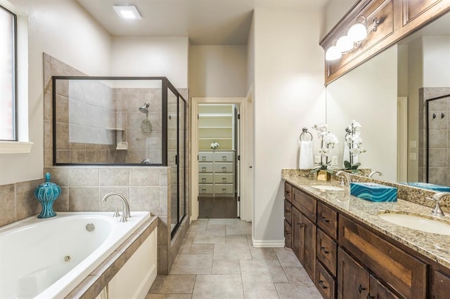 bathroom featuring tile patterned floors, vanity, and separate shower and tub