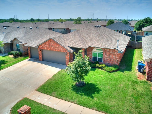 view of front facade featuring a garage and a front yard