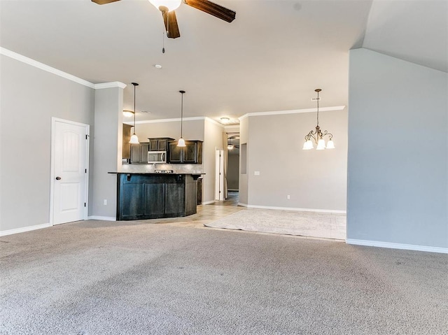 unfurnished living room with light carpet, ceiling fan with notable chandelier, ornamental molding, and lofted ceiling