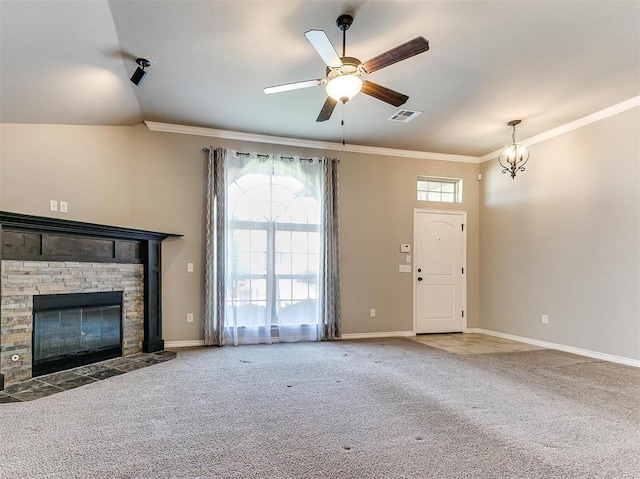 unfurnished living room with a stone fireplace, a wealth of natural light, and carpet