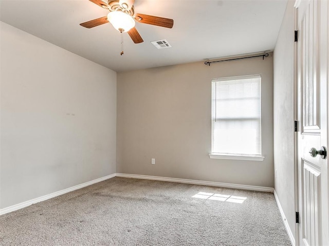 unfurnished room with carpet and ceiling fan