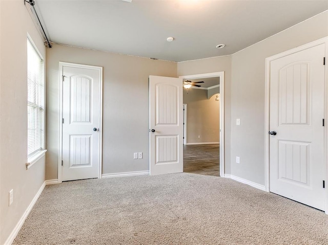 unfurnished bedroom featuring light colored carpet