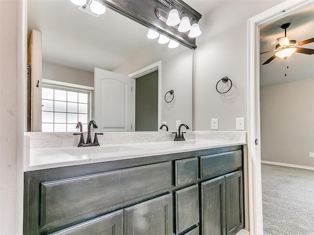 bathroom with ceiling fan and vanity