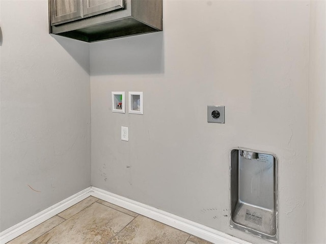 washroom with hookup for a washing machine, hookup for an electric dryer, and cabinets