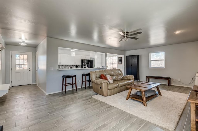 living room with ceiling fan