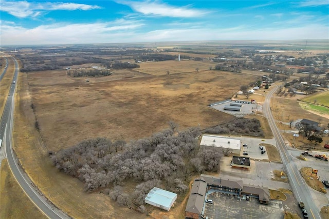 birds eye view of property featuring a rural view