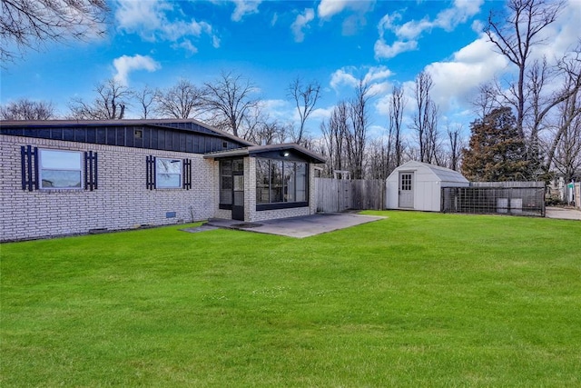 back of property featuring a storage shed, a patio, and a lawn