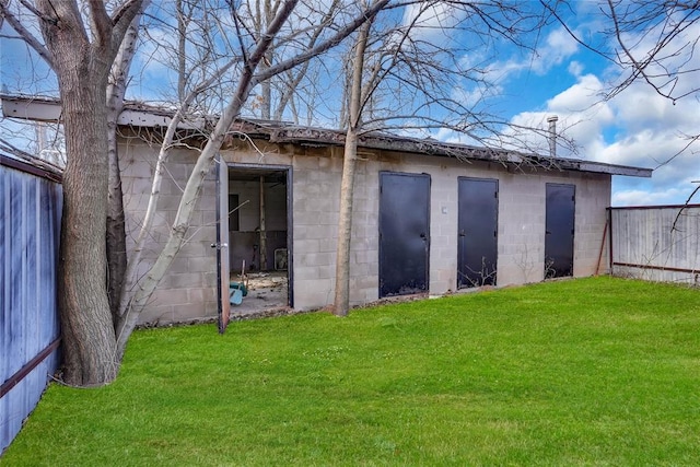 view of outbuilding featuring a yard