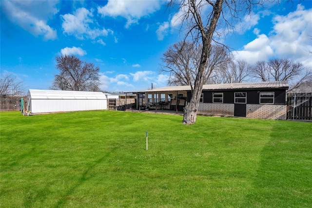 back of house featuring a yard