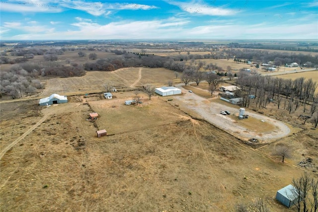 birds eye view of property featuring a rural view