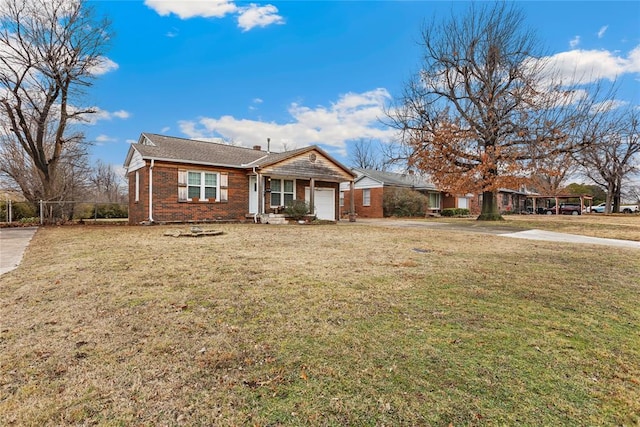 single story home featuring a garage and a front lawn