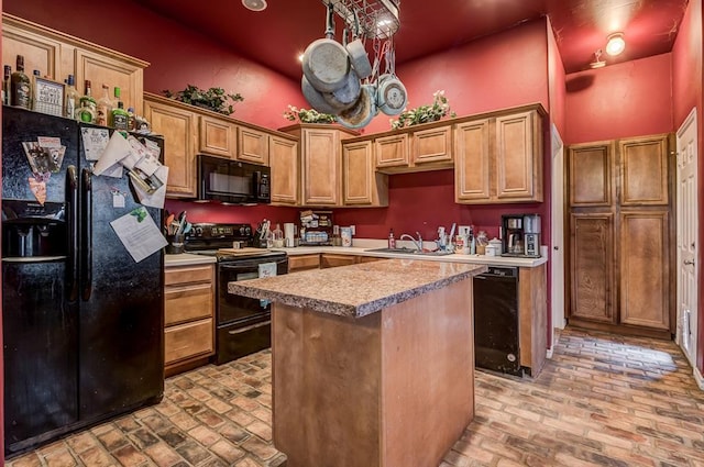 kitchen featuring sink, a high ceiling, black appliances, a kitchen island, and beverage cooler