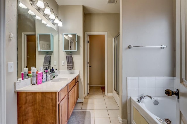 bathroom featuring tile patterned floors, independent shower and bath, and vanity